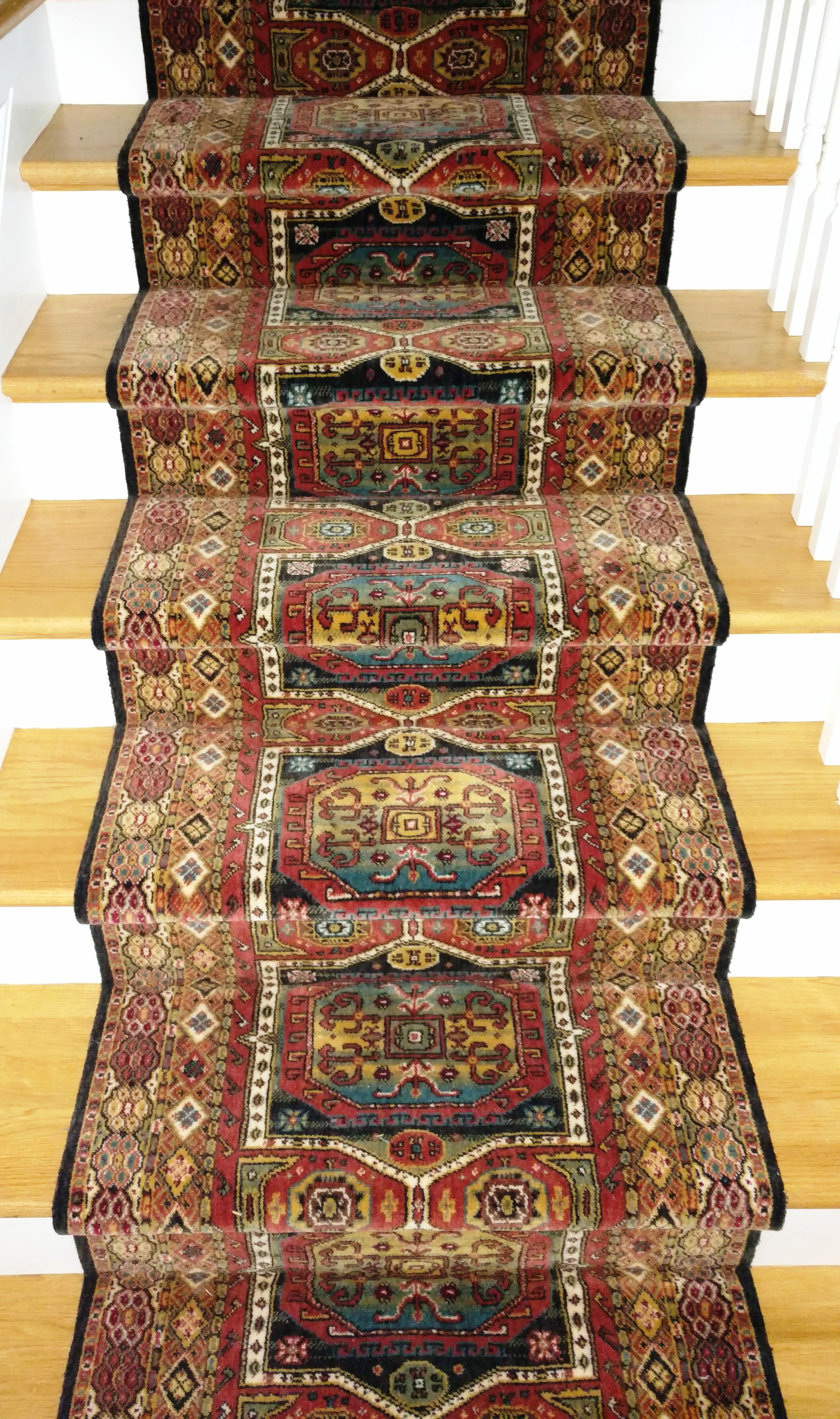 http://rugdepothome.com/cdn/shop/products/momeni-stair-runner-30-in-x-1-ft-sold-by-the-foot-persian-garden-black-stair-runner-pg16-multi-30in-sold-by-the-foot-29240168644671.jpg?v=1647809166